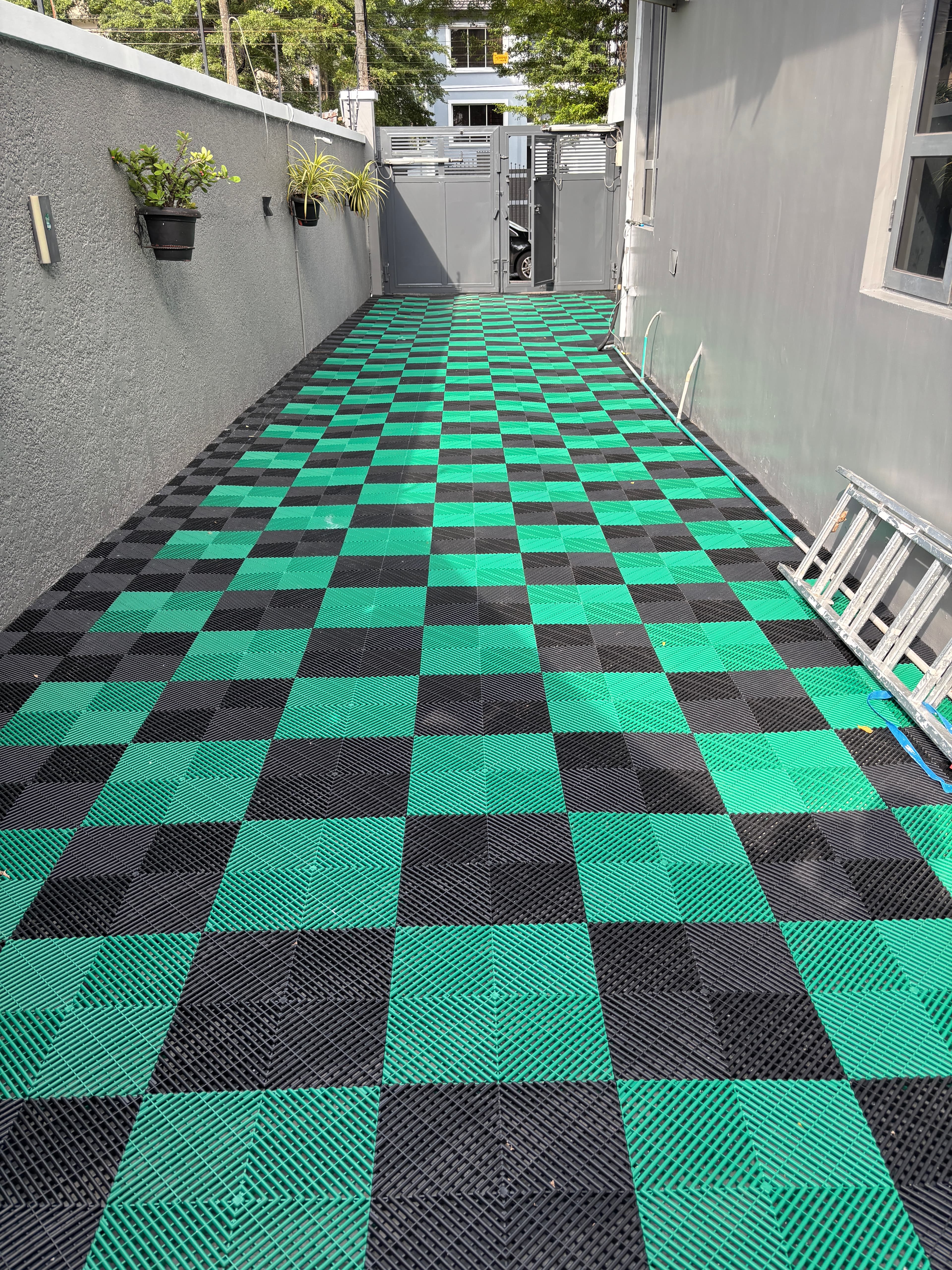 Green & black checker tile wall installation