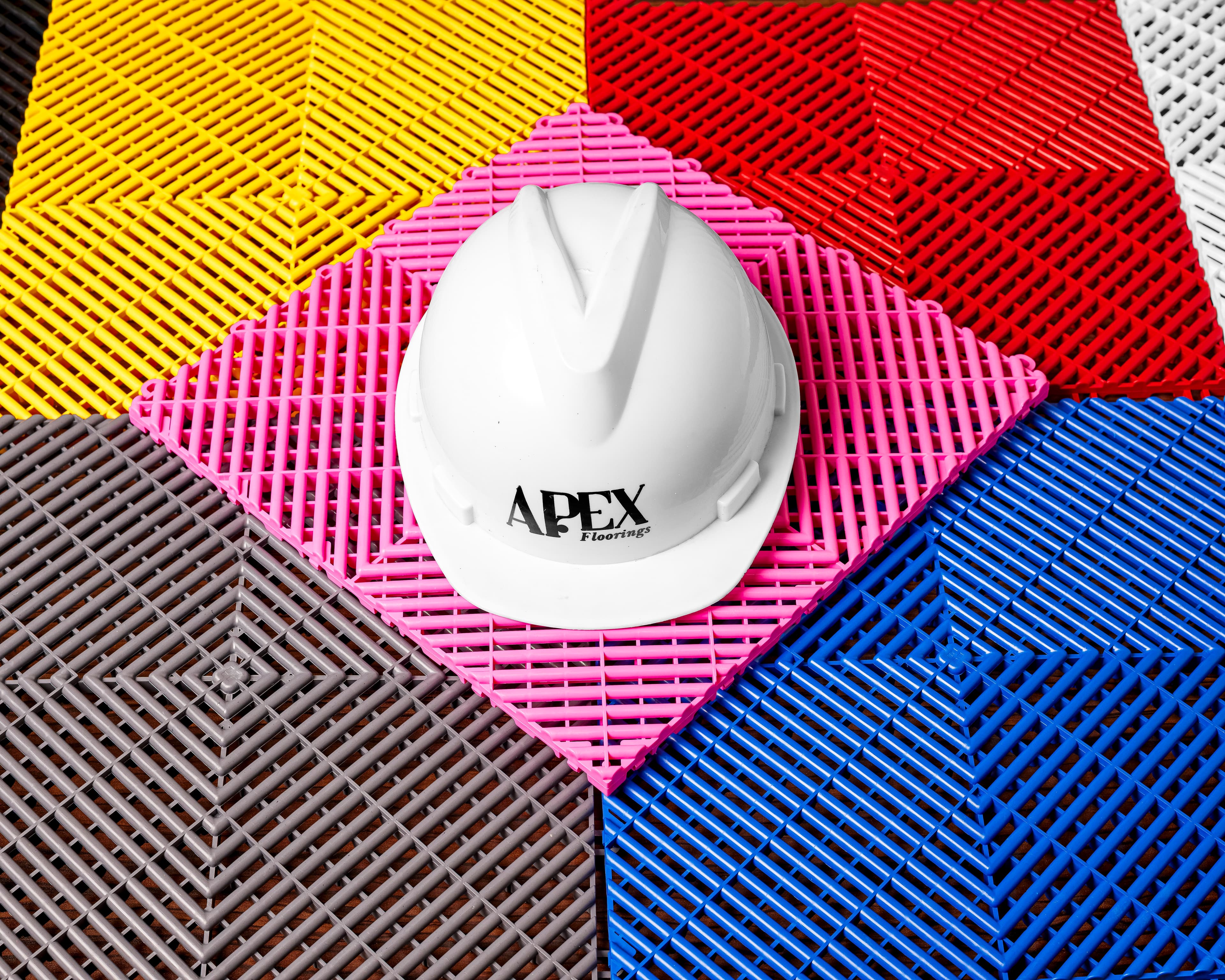 Apex Floorings hard hat on colourful tile arrangement