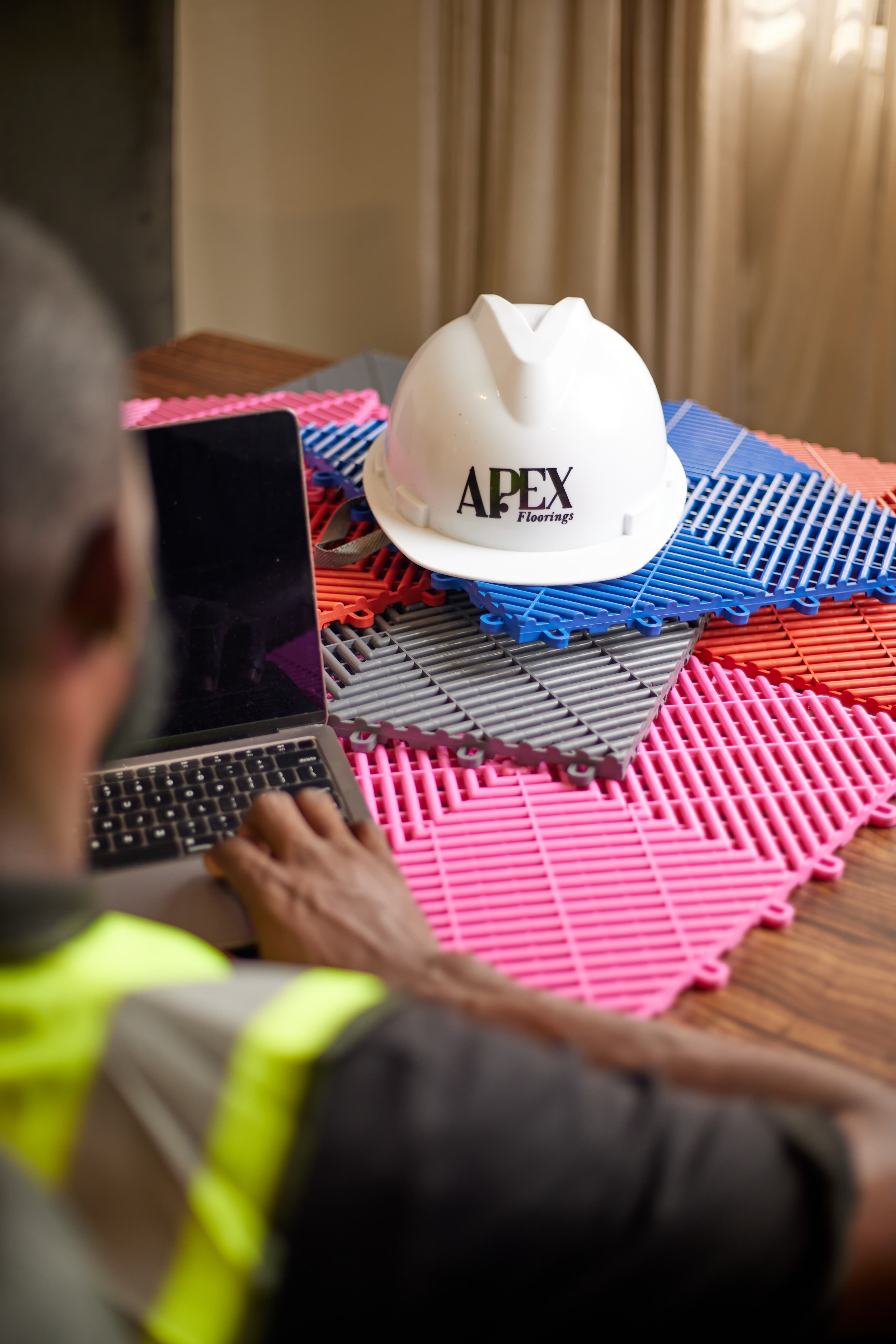 Apex team with tile samples and project plan