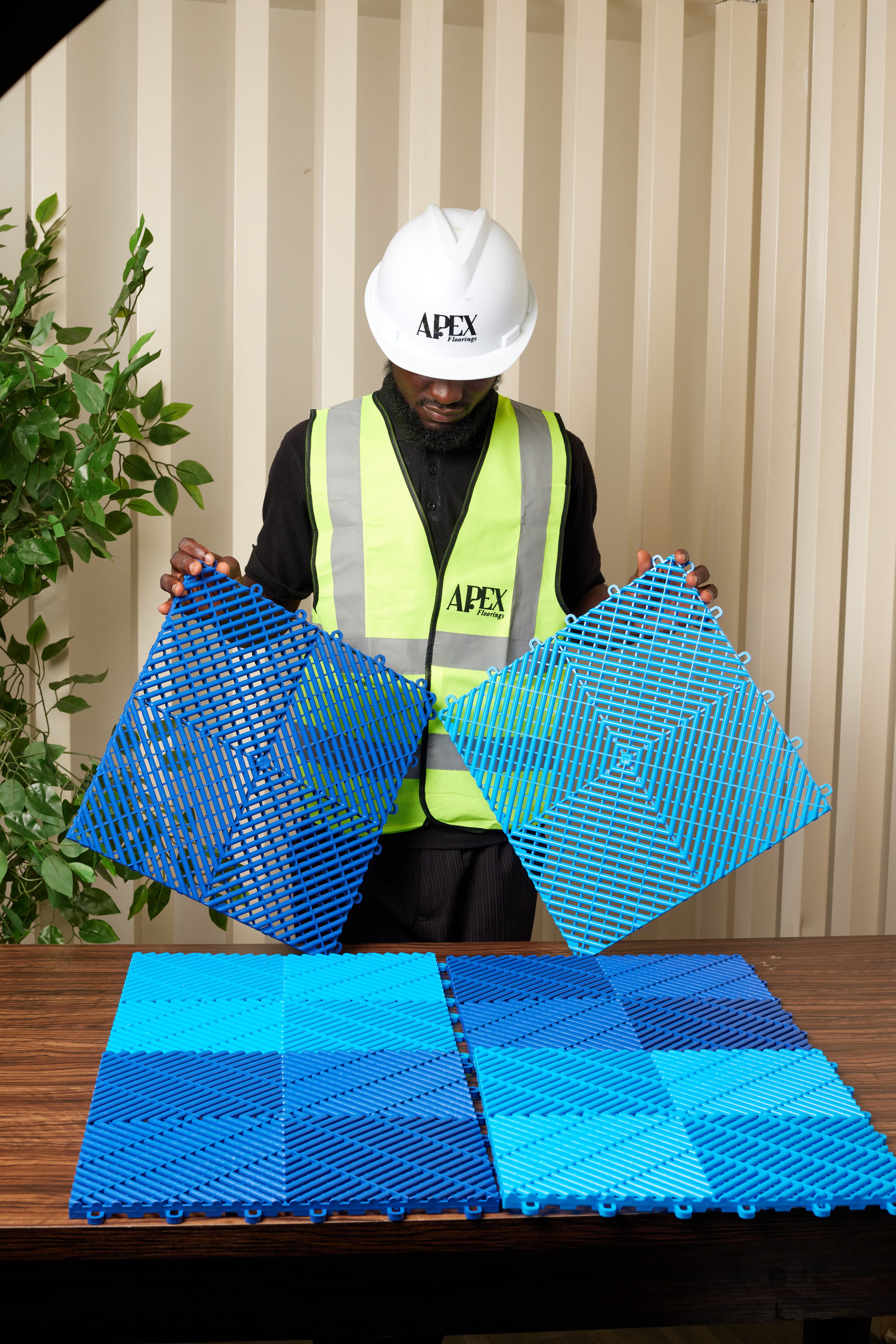 Apex team member showcasing blue tile range